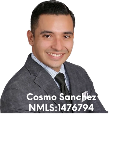 Professional headshot of Cosmo Sanchez in a suit.