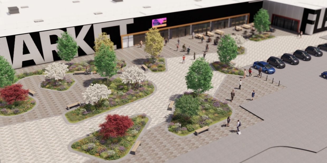 Outdoor plaza with trees, benches, and people in front of a market building.
