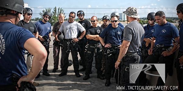 Mario Knapp training SWAT personnel in tactical rappelling class for police and military.