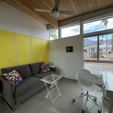 One of the three bedrooms with a top quality couch that converts to a queen size solid platform bed