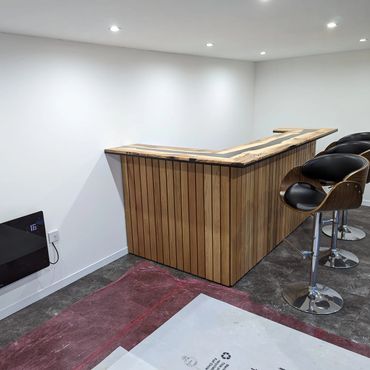 Black resin in between ash boards for a stunning bar