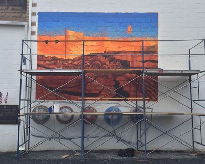Mural in progress on exterior of the Mt. Carmel VFW