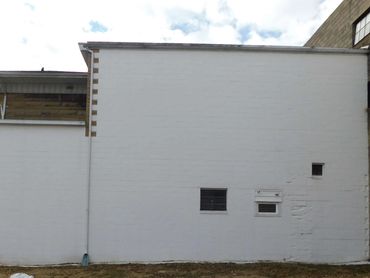 Blank wall before the outdoor Mount Carmel VFW mural