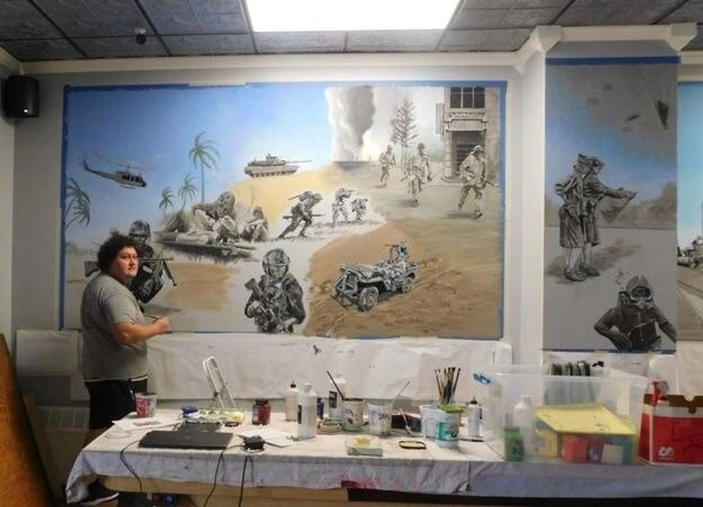 indoor Mount Carmel VFW mural. Logan McCracken shading Huey on left wall