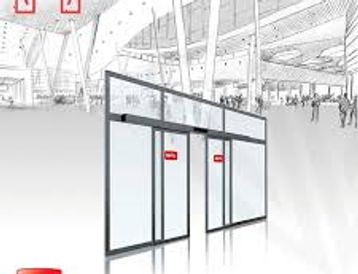 Automatic sliding glass doors in a modern building entrance.