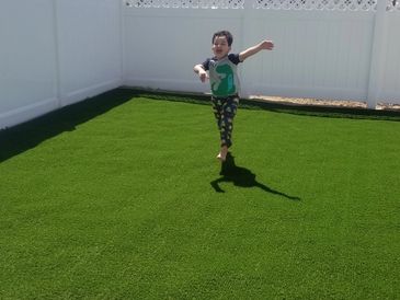 A child playing on turf