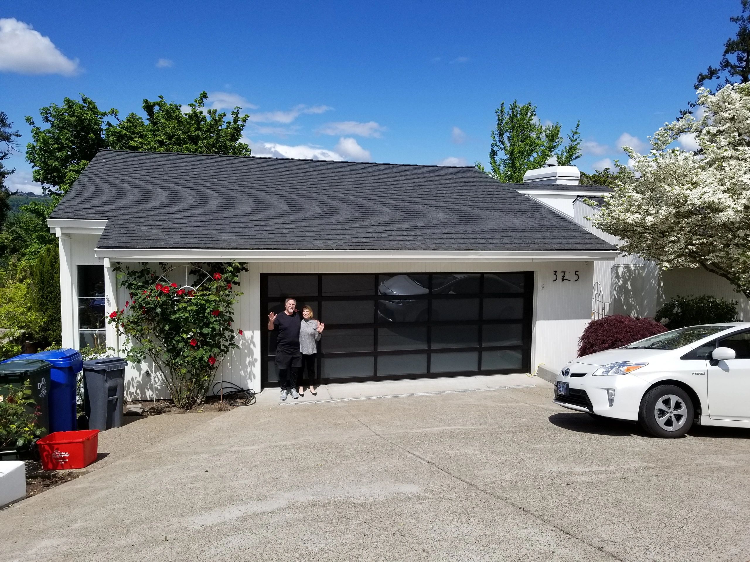 Happy customer's of ours with their Vista all glass garage door!
