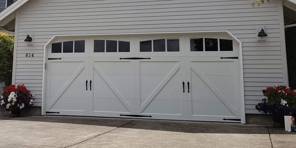 Vinyl overlay carriage court garage doors installed