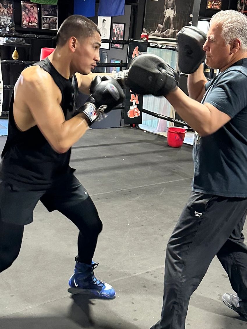 Coach Aleman working mitts with 154 pound world champion Vergil Ortiz at Aleman Boxing Fresno