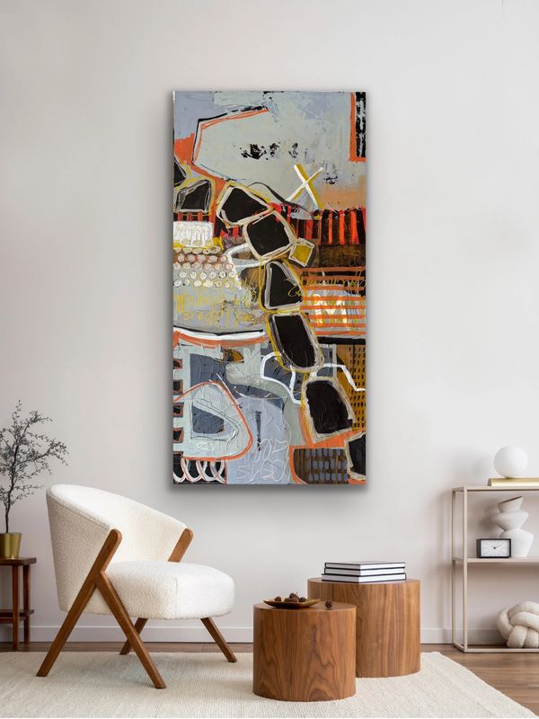 Modern abstract painting with geometric shapes in a minimalist living room.