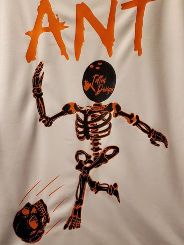 Stylized skeleton kicking a skull with bold orange text "ANT" above it.