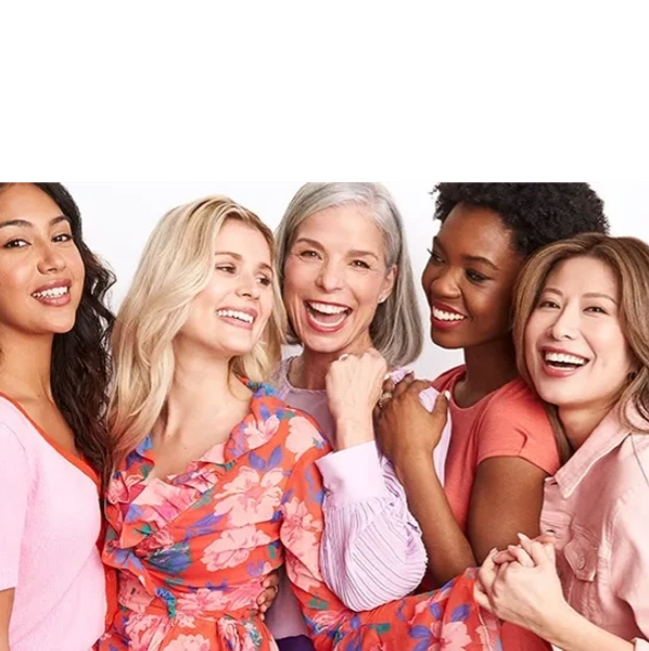Group of diverse women smiling and embracing.
