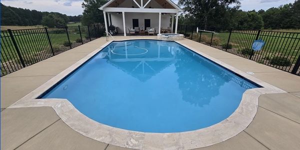 Beautiful shot of pool with still water and covered gazebo area