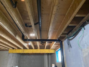 Pex Plumbing Pipes Exposed During Rough-In Stage Of Construction