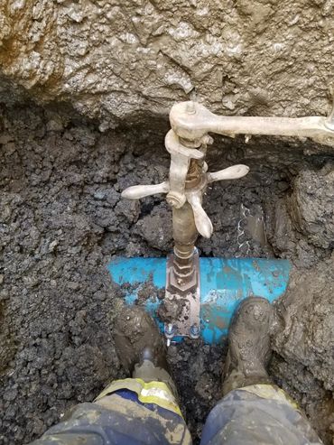 Exposed in ground main water line bieng repaired