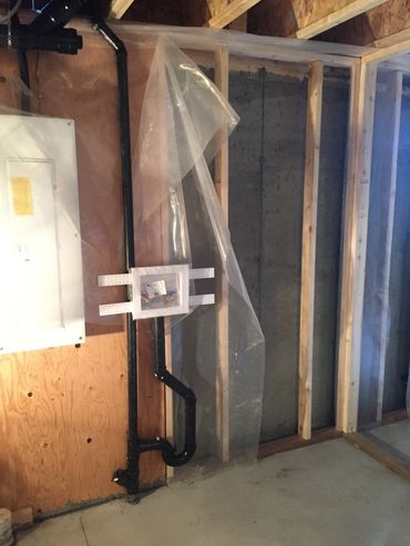 Pex Plumbing Pipes Exposed In Basement During Rough-In Stage Of Construction