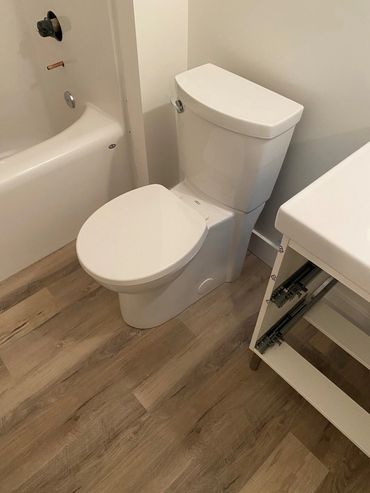 Toilet installation during finishing stage of construction