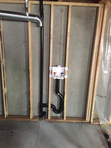 Pex Plumbing Pipes Exposed During Rough-In Stage Of Construction