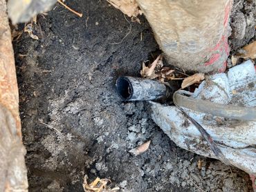 Exposed sewer line dug up