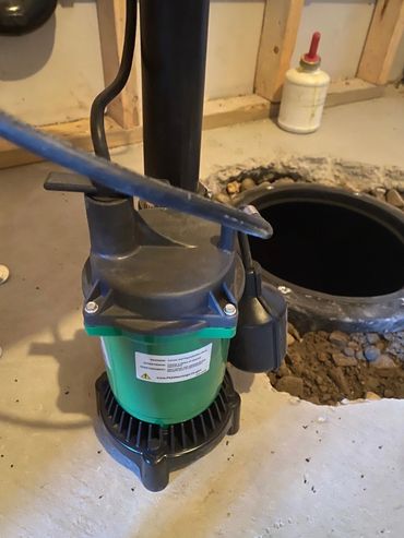 New Sump Pump shown outside of sump pit