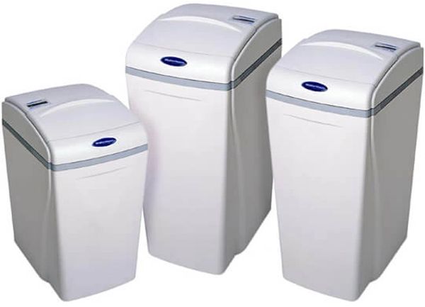 Line up of three different waterboss water softeners on white background.