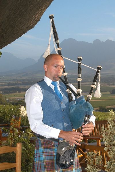 The Sussex Bagpiper playing in Paarl, South Africa