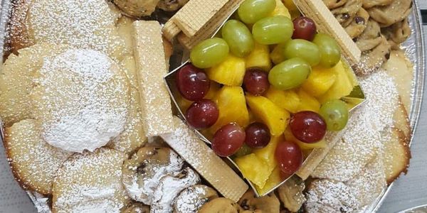 Assorted homemade cookie platter lightly dusted with powdered sugar