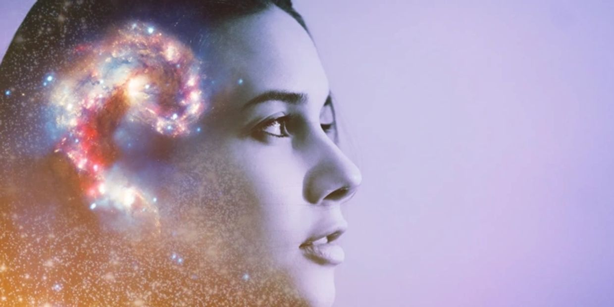 Image of a woman with a galaxy in her head. Image credit: raisondtre - stock.adobe.com