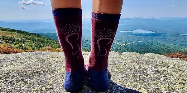 Warm Peet merino wool socks hiking on Saddleback Mountain, Maine