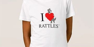 The design on this t-shirt is inspired by the book series, "Rattles, the Barn Cat."