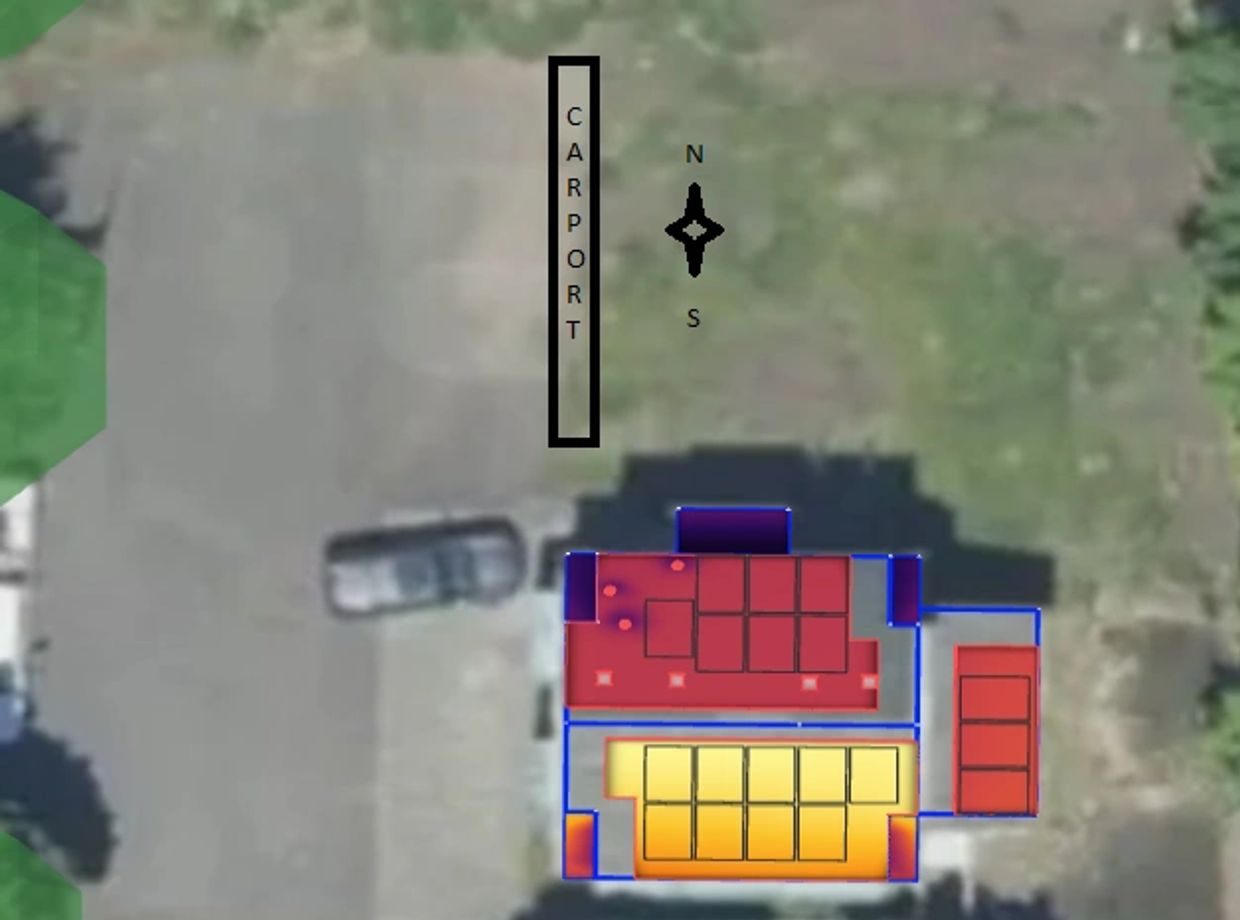 Aerial view of a carport and building layout with marked sections and a compass.