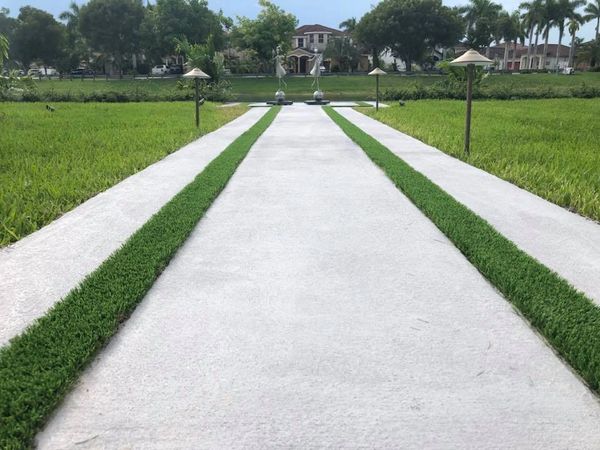 Synthetic grass strips between concrete slabs Miami