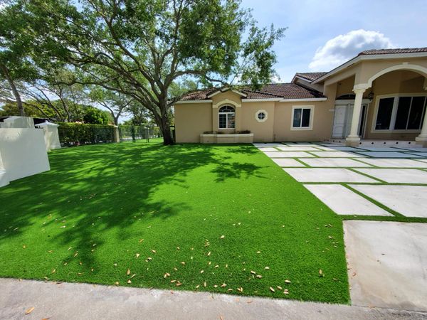 Synthetic grass strips between concrete slabs Miami