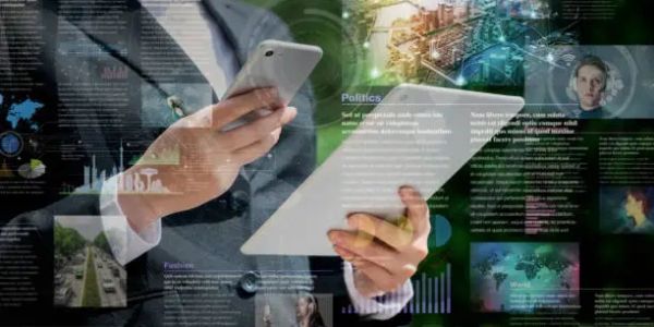 Person in suit using phone and tablet with digital data overlays.