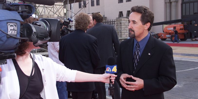 American journalist Bryce Zabel is interviewed by television reporters.