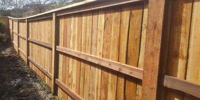 Wood Fence with redwood top cap and steel posts