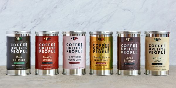 Various coffee tins labeled with different coffee blends.