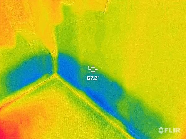 Thermal imaging showing water damage on drywall in home.