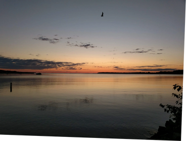 Suttons Bay Michigan at sunset, waterfront condo views.