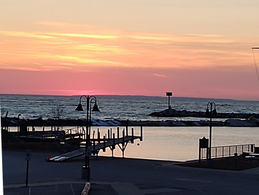 Leland Harbor on Lake Michigan at sunset overlooking the Manitou Passage.