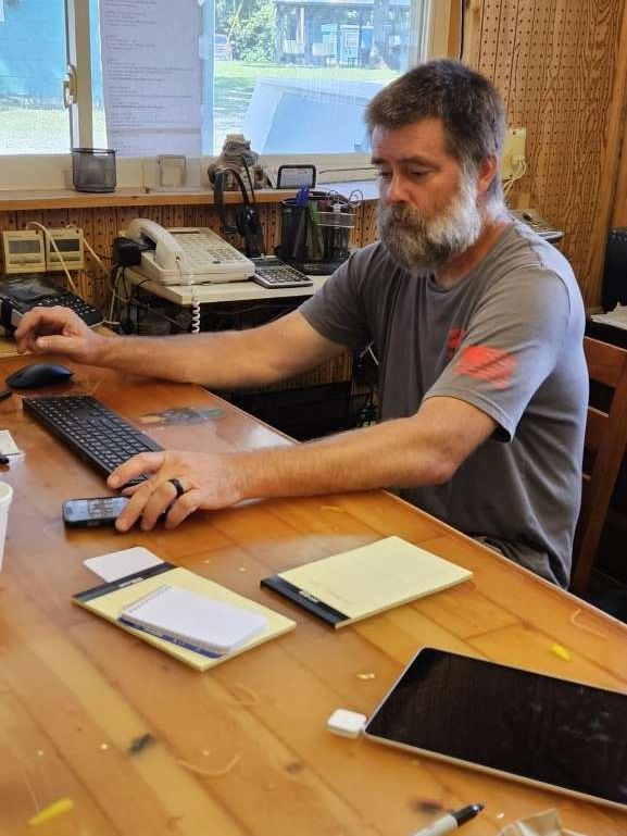 Troy Bemis at the front desk.