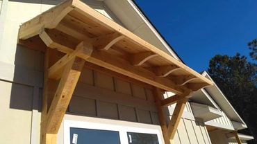 Rough cut cypress eyebrow roof