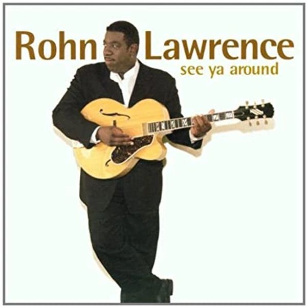 Rohn Lawrence holding a guitar on an album cover.