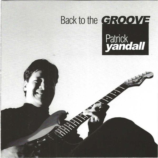 Patrick Yandall playing guitar with the text 'Back to the GROOVE'.