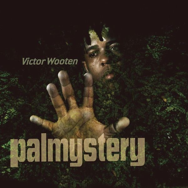Album cover featuring Victor Wooten with a hand reaching out.
