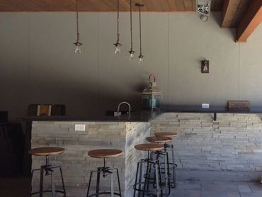 Outdoor Living bar under deck with covered area