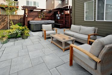 Outdoor Living with hot tub and privacy screen