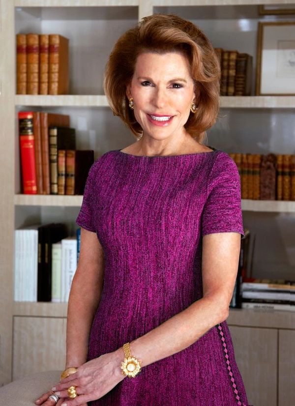 Ambassador Nancy Brinker, founder of Susan G. Komen and Promise Fund - standing in a home library wi