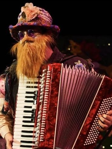 Steve with his accordion as Autolycus in The Winter's Tale