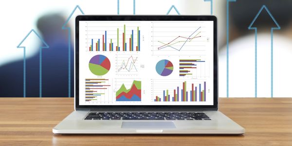 A laptop with charts and graphs illustrates what a marketing portfolio analysis looks like